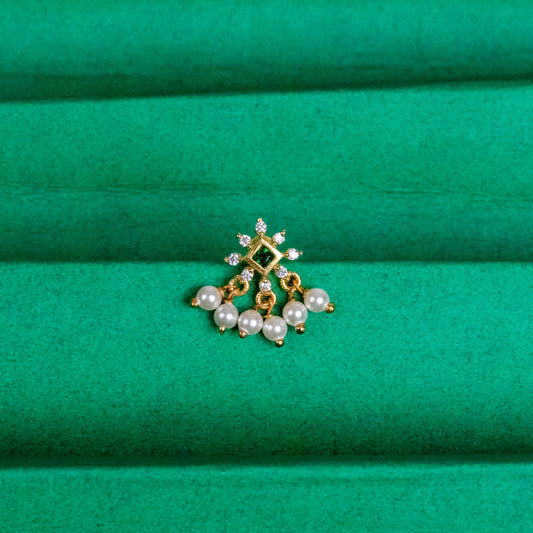 Silver nosepins featuring traditional motifs with a modern design twist, displayed on a neutral background.
