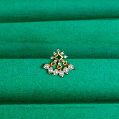 Silver nosepins featuring traditional motifs with a modern design twist, displayed on a neutral background.