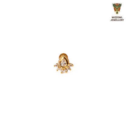 Silver nosepins featuring traditional motifs with a modern design twist, displayed on a neutral background.