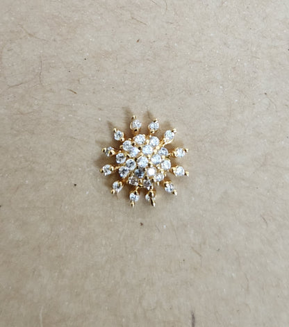 Silver nosepins featuring traditional motifs with a modern design twist, displayed on a neutral background.