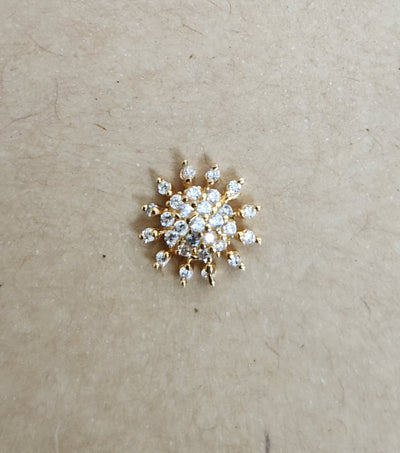 Silver nosepins featuring traditional motifs with a modern design twist, displayed on a neutral background.