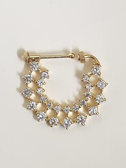 Silver nosepins featuring traditional motifs with a modern design twist, displayed on a neutral background.