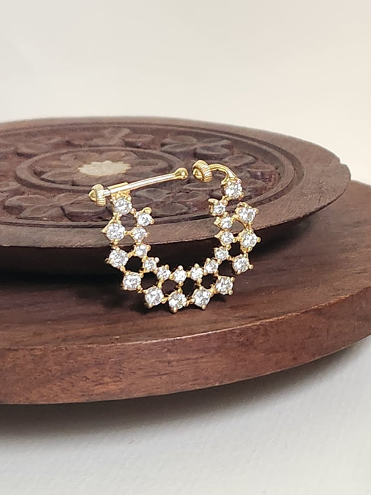 Silver nosepins featuring traditional motifs with a modern design twist, displayed on a neutral background.