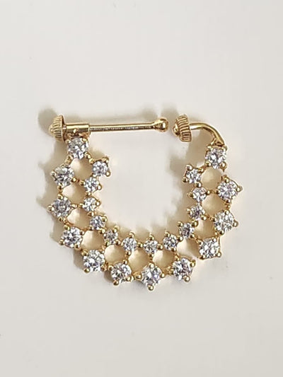 Silver nosepins featuring traditional motifs with a modern design twist, displayed on a neutral background.