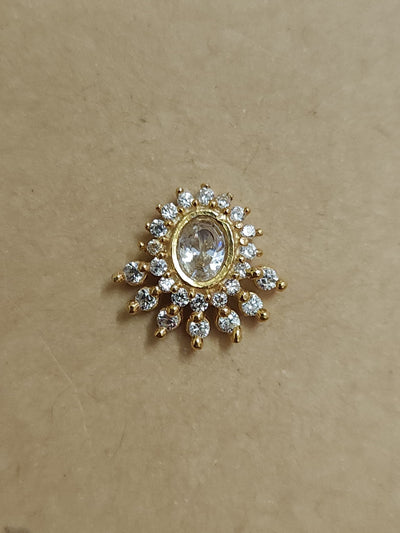 Silver nosepins featuring traditional motifs with a modern design twist, displayed on a neutral background.