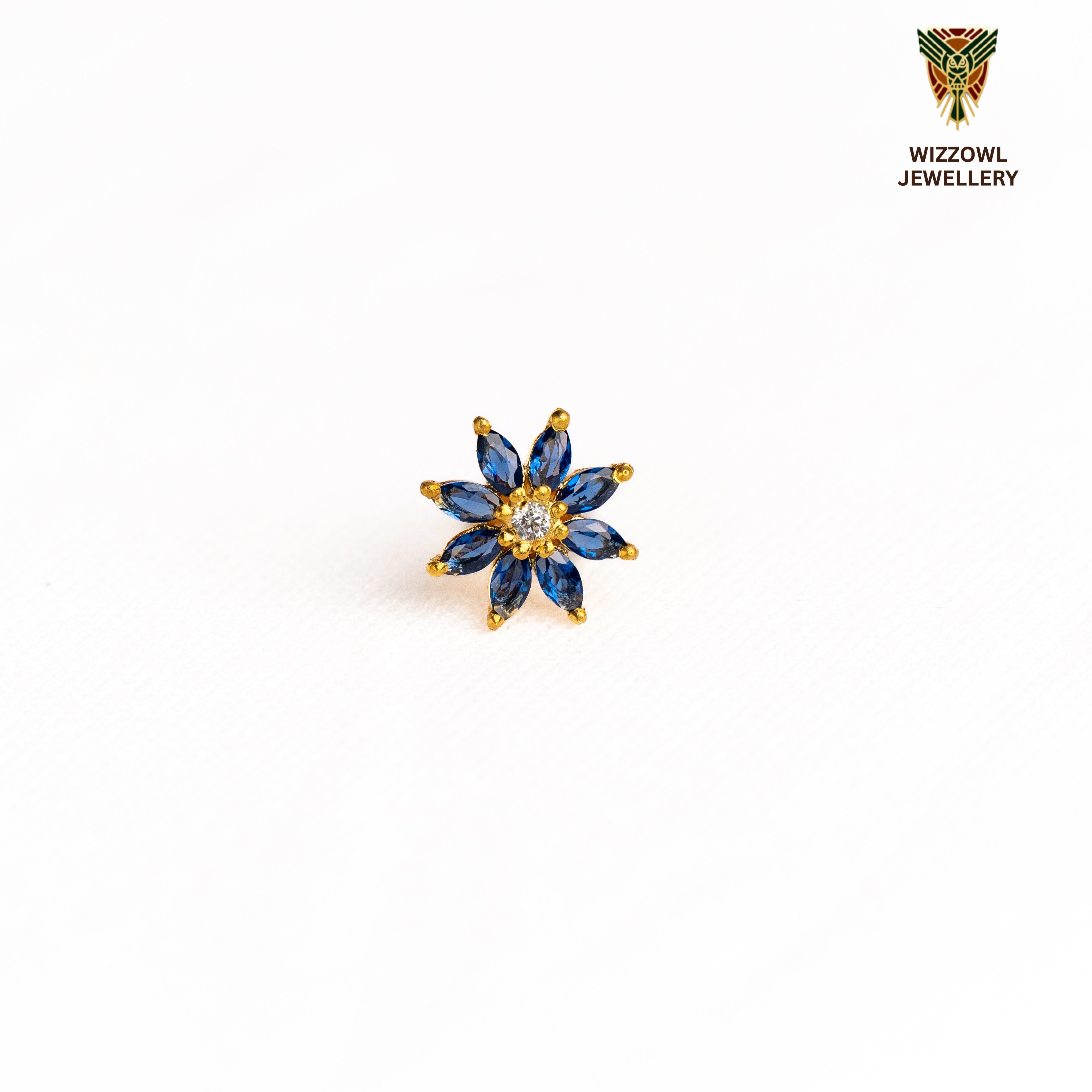 Silver nosepins featuring traditional motifs with a modern design twist, displayed on a neutral background.