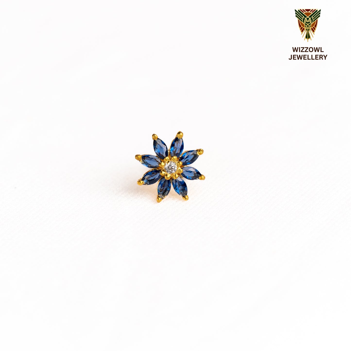 Silver nosepins featuring traditional motifs with a modern design twist, displayed on a neutral background.
