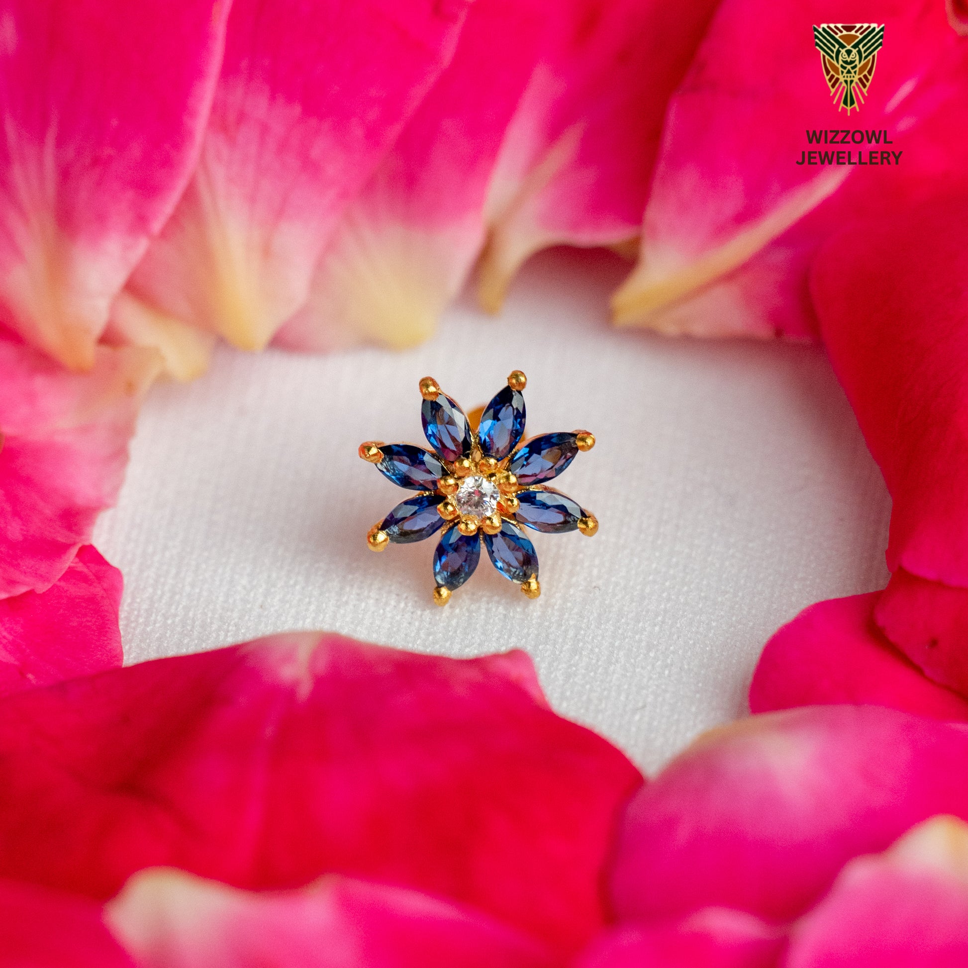 Silver nosepins featuring traditional motifs with a modern design twist, displayed on a neutral background.