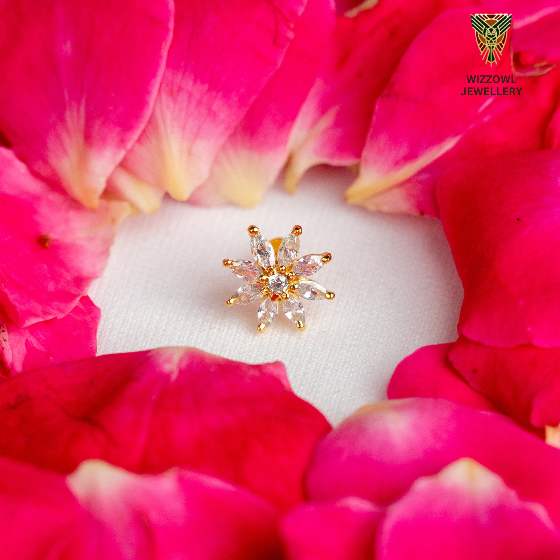 Silver nosepins featuring traditional motifs with a modern design twist, displayed on a neutral background.