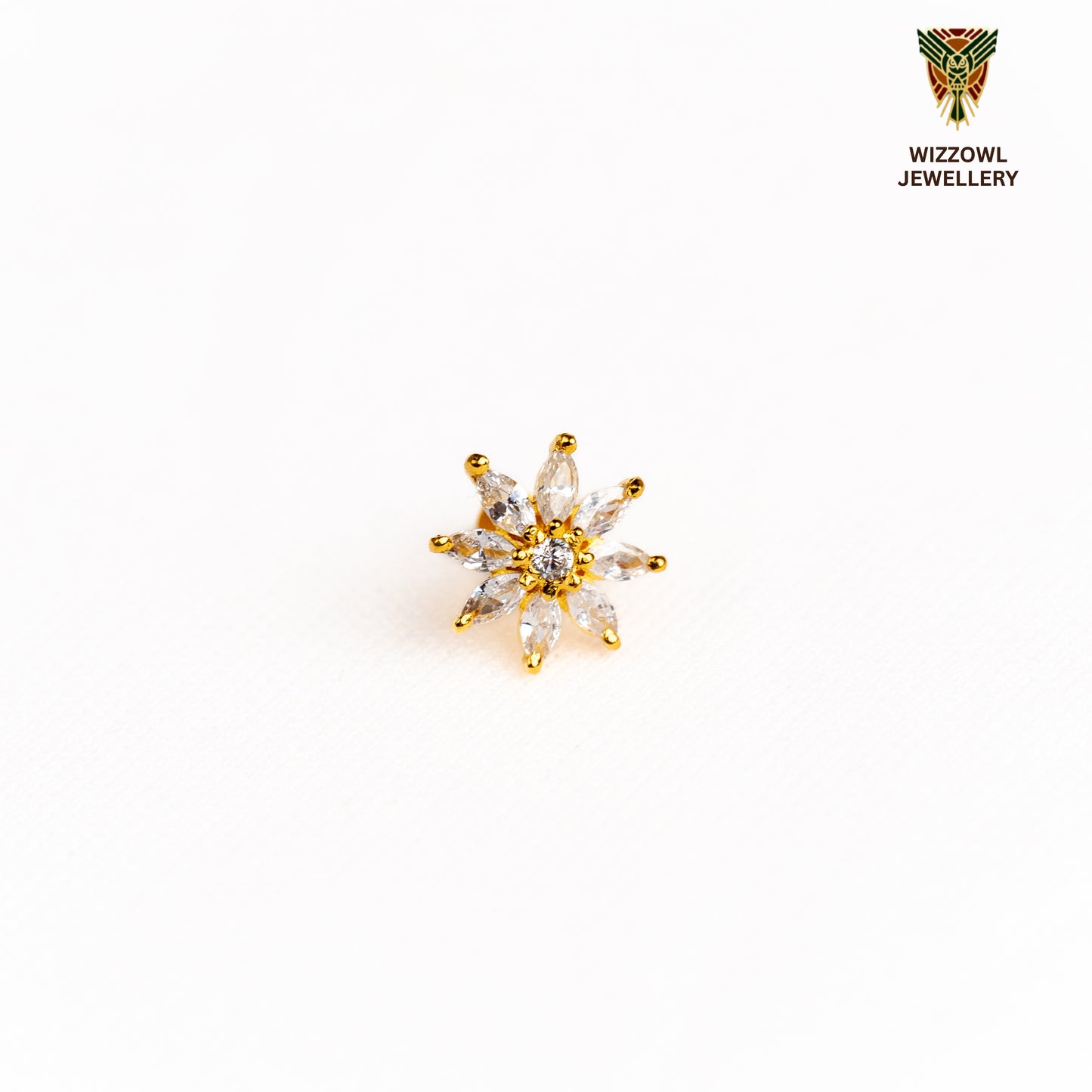Silver nosepins featuring traditional motifs with a modern design twist, displayed on a neutral background.