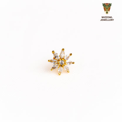 Silver nosepins featuring traditional motifs with a modern design twist, displayed on a neutral background.