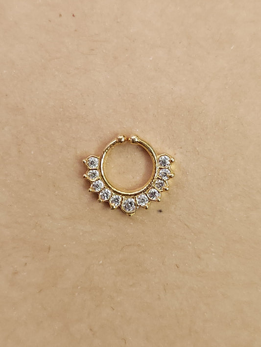 Silver nosepins featuring traditional motifs with a modern design twist, displayed on a neutral background.