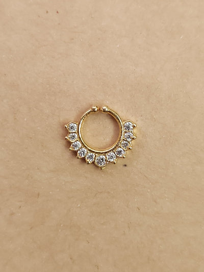 Silver nosepins featuring traditional motifs with a modern design twist, displayed on a neutral background.