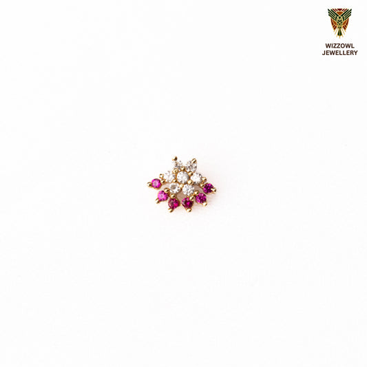 Silver nosepins featuring traditional motifs with a modern design twist, displayed on a neutral background.