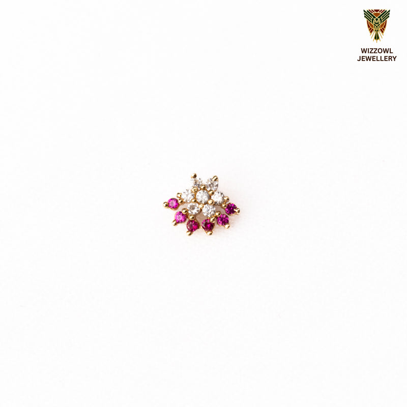 Silver nosepins featuring traditional motifs with a modern design twist, displayed on a neutral background.