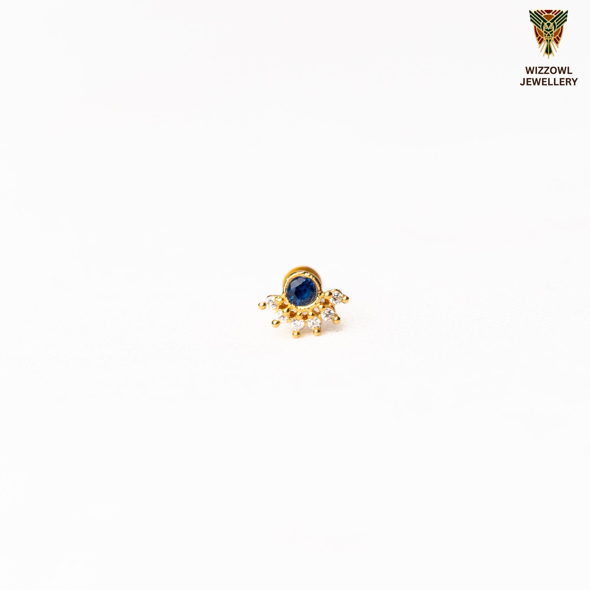 Silver nosepins featuring traditional motifs with a modern design twist, displayed on a neutral background.