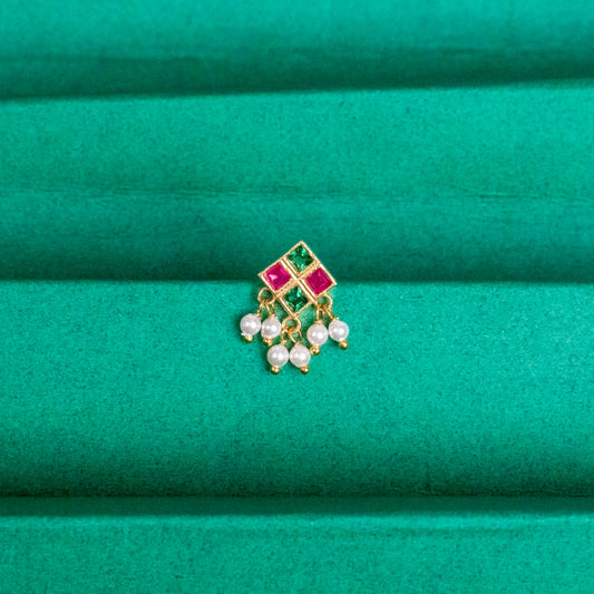Silver nosepins featuring traditional motifs with a modern design twist, displayed on a neutral background.