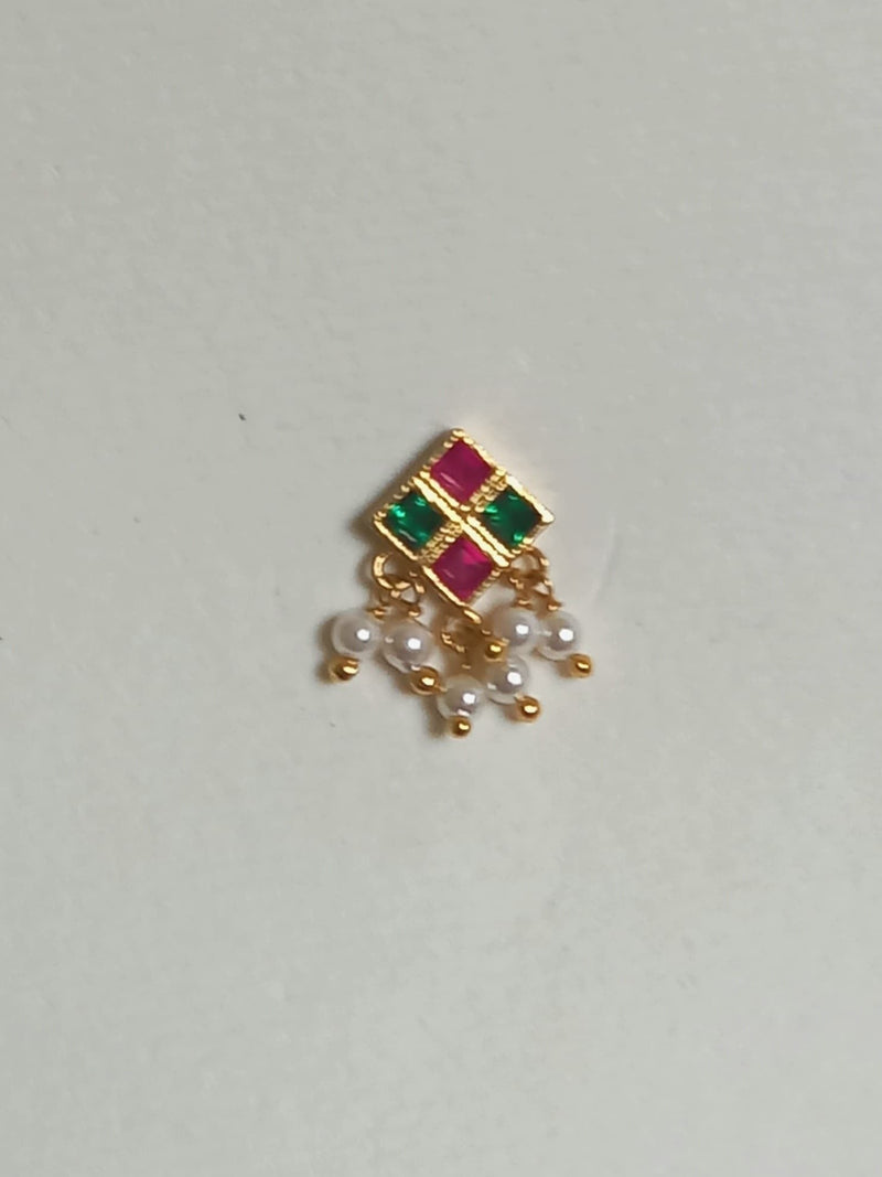 Silver nosepins featuring traditional motifs with a modern design twist, displayed on a neutral background.