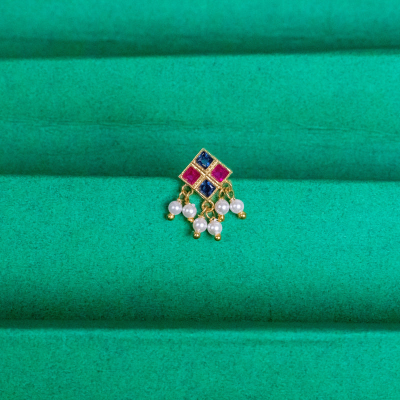 Silver nosepins featuring traditional motifs with a modern design twist, displayed on a neutral background.