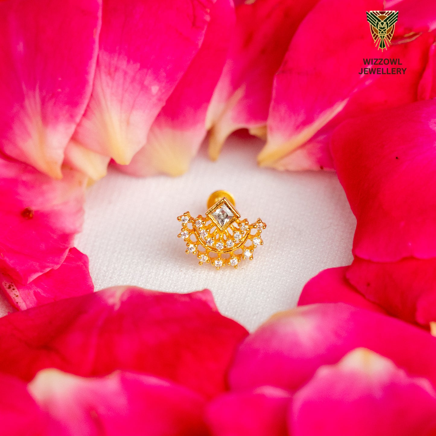 Silver nosepins featuring traditional motifs with a modern design twist, displayed on a neutral background.