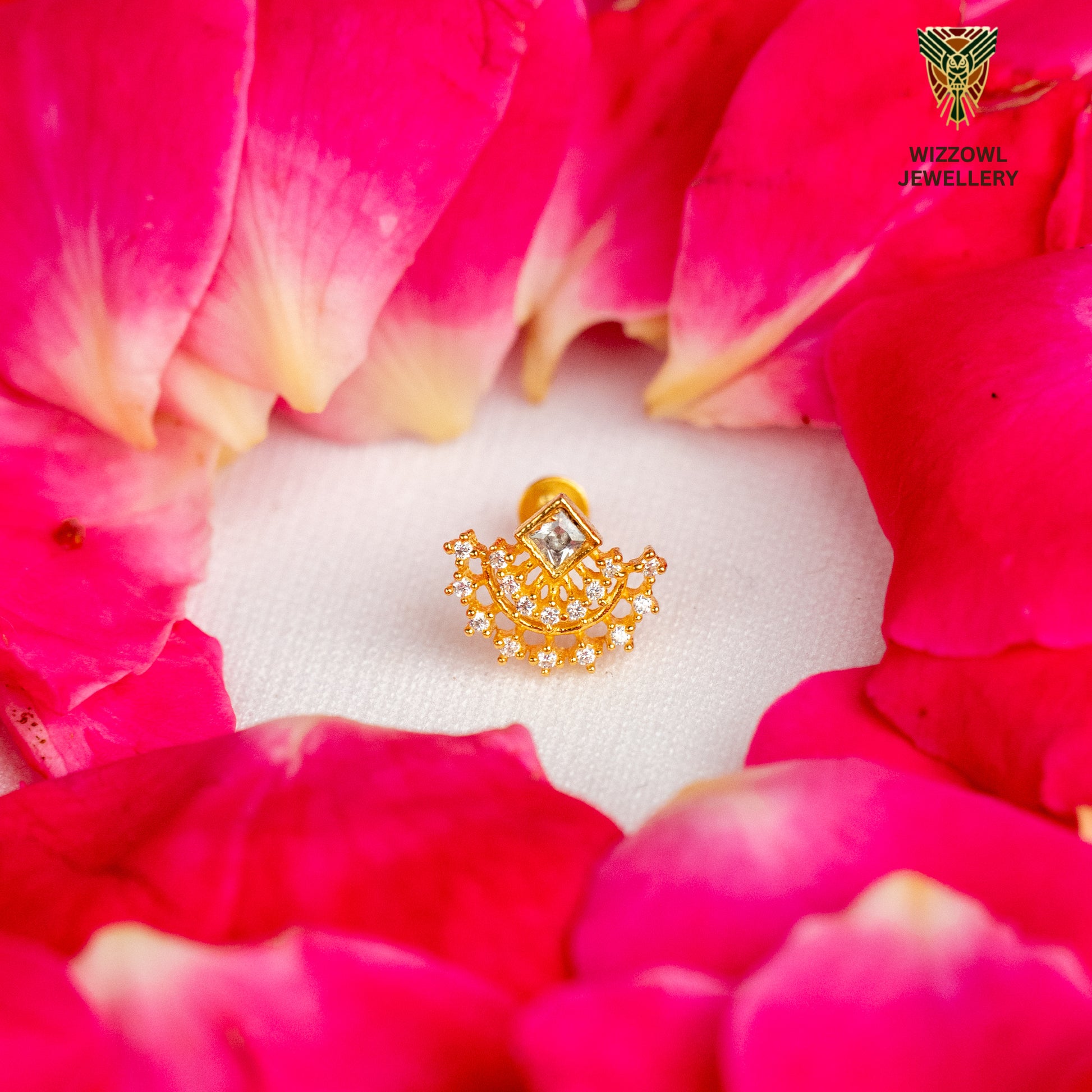 Silver nosepins featuring traditional motifs with a modern design twist, displayed on a neutral background.