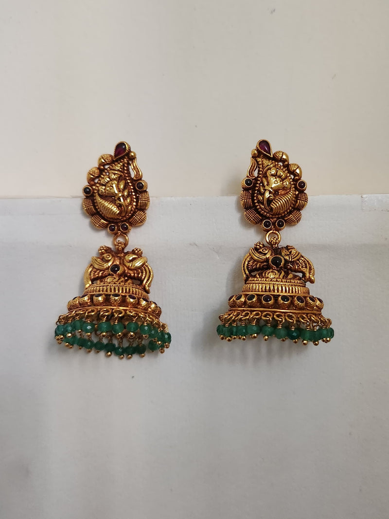 A pair of silver earrings with green accents and intricate designs, displayed against a light background.