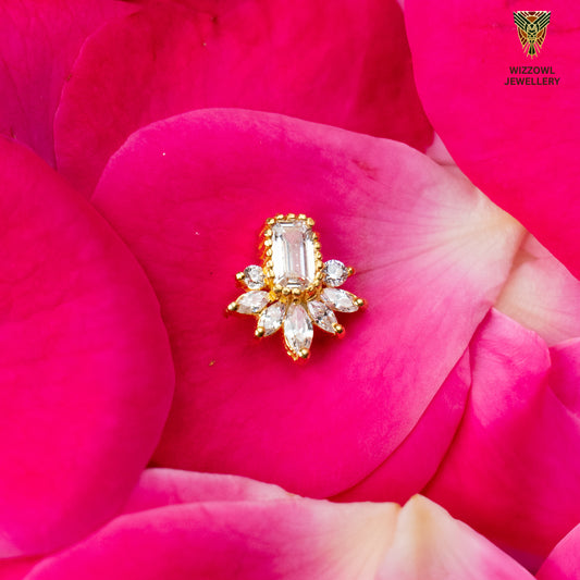 Silver nosepins featuring traditional motifs with a modern design twist, displayed on a neutral background.