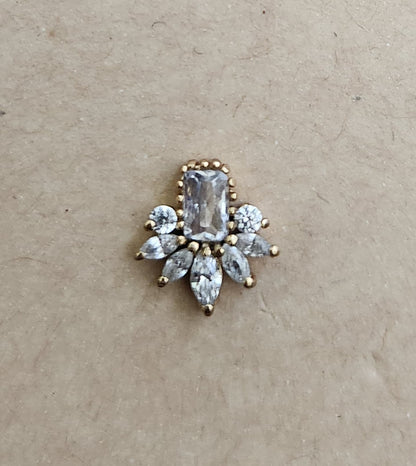 Silver nosepins featuring traditional motifs with a modern design twist, displayed on a neutral background.