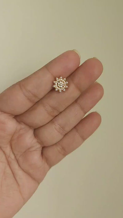 Silver nosepins featuring traditional motifs with a modern design twist, displayed on a neutral background.