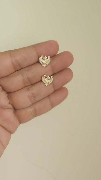 Silver nosepins featuring traditional motifs with a modern design twist, displayed on a neutral background.